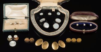 A pair of 18ct gold oval panel cuff-links of hammered finish design with three matching dress