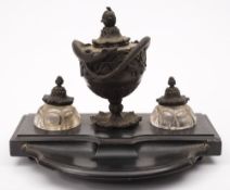 A 19th century French bronze and black marble desk inkstand: of bow front outline,