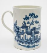 A First Period Worcester blue and white mug: of cylindrical form with grooved loop handle,