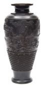 A Japanese bronze vase: of slender oviform moulded in low relief with an circling landscape band