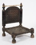 A 19th Century Indian carved wood ceremonial stool:,