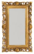 A late 19th Century carved giltwood Florentine frame rectangular mirror:,