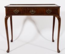 A mid 18th century mahogany silver table:, the rectangular moulded tray top with re-entrant corners,