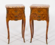 A pair of French tulipwood, floral marquetry and gilt metal mounted bombe petit commodes:,
