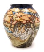 A Moorcroft pottery vase: of oviform tubelined in the Fowlers Patch pattern after the original by