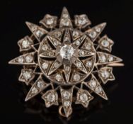 A late 19th century gold, silver and diamond mounted circular star pendant/brooch: with graduated,