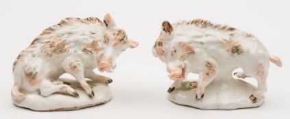 A pair of Torquay porcelain models of 'Derby' Florantine boars: with brown and grey markings and on