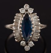 A sapphire and diamond marquise shaped cluster ring: the marquise shaped sapphire within a surround