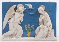A Della Robbia type rectangular pottery plaque: of the Annunciation with the seated figure of Mary,