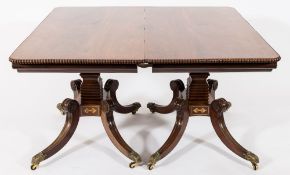 A good Regency mahogany and brass inlaid twin pillar dining table:,