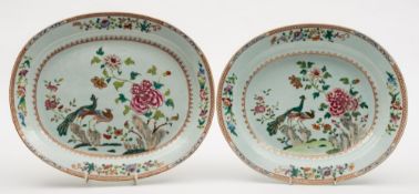 A Chinese famille rose 'double-peacock' pattern oval dish and one similar: each painted with two