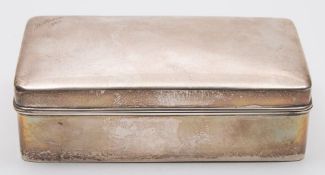 A Chinese silver cigarette box by Wang Hing, Hong Kong: inscribed, of rectangular outline,