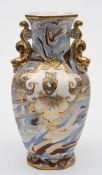 An Ironstone agate ware vase: of octagonal profile, the baluster body with gilt dolphin handles,