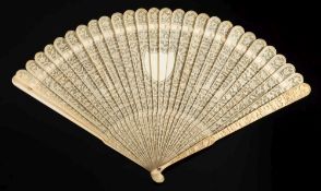 A 19th century Cantonese single side carved ivory brise fan: the pierced leaves with central shield