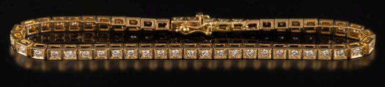 An 18ct yellow gold and diamond bracelet: with circular,