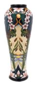 A Moorcroft pottery vase: of slender baluster form tubelined in the Avon Water pattern after an