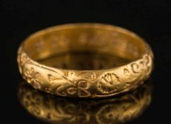 An 18th century gold posy ring:, chased with floral motifs,