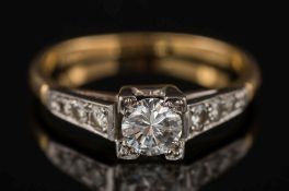 A gold and diamond single-stone ring: with circular brilliant-cut diamond approximately 0.