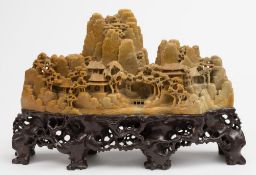 A large Chinese soapstone mountain village: carved and polished with mountain peaks and outcrops,