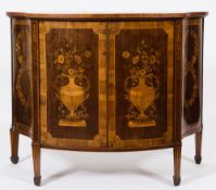An Edwardian mahogany and floral marquetry low side cabinet:, of shaped and bow fronted outline,