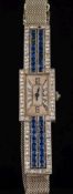A lady's sapphire and diamond cocktail wristwatch: the rectangular dial on a bracelet with