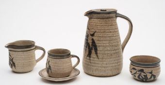 Robert Tinnyunt (born 1940) a stoneware coffee service: comprising a coffee pot and cover, milk jug,