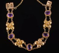 A 9ct gold and oval amethyst bracelet: with single oval amethysts between cannetille design