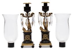 A pair of 19th century French Empire gilt metal and bronze storm lamp / candlesticks 49.5cm. high.