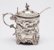A Victorian silver lidded mustard pot, makers mark rubbed, London, 1878: crested,