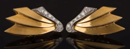 A pair of 18ct gold and diamond wing design clip stud earrings: with graduated,