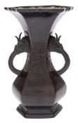 A Chinese bronze vase: of archaic Gu form,