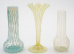 Three various 'vaseline' art glass vases: comprising a yellow tinged and white veined trumpet