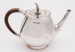 An Elizabeth II silver teapot, maker RW, Birmingham, 1960: of ovoid form, on a circular foot, 25.