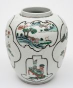 A Chinese famille verte oviform jar: painted with black line foliate shaped panels containing lake