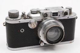 A Leica III model F Rangefinder camera: serial number 237451, chrome finish with black crackle body,