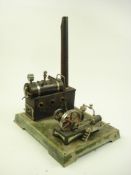 An early 20th century Continental tinplate model of a stationary engine:, possibly Bing,