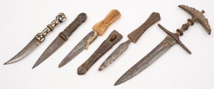 A 19th century Indian khanjarli style dagger with cast iron handle and hilt,