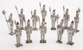 A collection of eleven figures of Medieval Knights by Britains and other makers:.