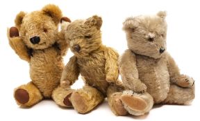 A Pedigree blonde plush musical Teddy Bear together with two other blonde plush bears:,