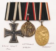 A German WWI trio:, 1914 Iron Cross, Veteran's Medal and Kyffhauser Medal, mounted as worn.