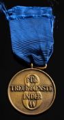 A German SS eight year service medal with ribbon:.