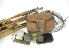 A Hardy landing net, two four bard reels, one stamped Prickman, Exeter,