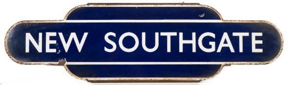 A British Rail (Eastern) railway totem sign for New Southgate:, white text on blue ground,