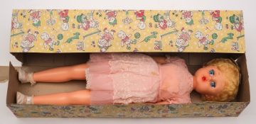 An 'Unbreakable vinyl/plastic Singing and Speaking Doll: 69cm.