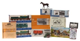 A collection of assorted railway model kits, figures, diecasts, scenic materials,