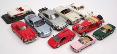 A collection of various 1/18th scale model cars:, including a Porsche 911,