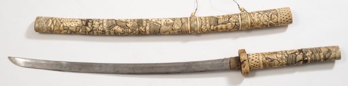 A late 19th /early 20th century Japanese katana in carved ivory and bone scabbard:,