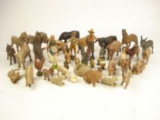 A collection of Elastolin and other farmyard figures:, including a farmer , his wife and farm boy,