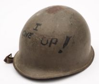 A US army M1 pattern helmet: with fibreglass liner and canvas straps.