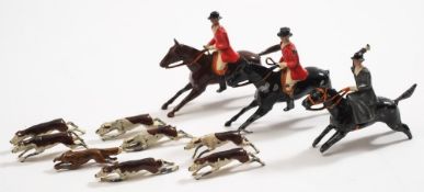 A Britains eleven piece Hunting Set:, comprising three horses and riders,